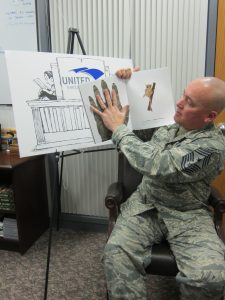 Chief Master Sergeant Mitch Brush, Nation Guard Bureau, recording a STEM title with United Through Reading.