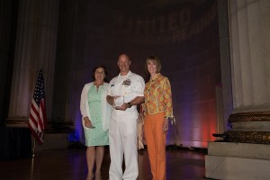 Doro Bush Koch, Honorary Chair of the Barbara Bush Foundation for Family Literacy; Command Master Chief David B. Carter, USS GEORGE. H. W BUSH (CVN 77); and United Through Reading Chief Executive Officer, Dr. Sally Ann Zoll, Ed.D at the 2015 Tribute to Military Families.
